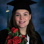 Zenith Vanstone in a graduation gown and 2024 graduation cap.